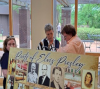 Mackey speaks with a tourist